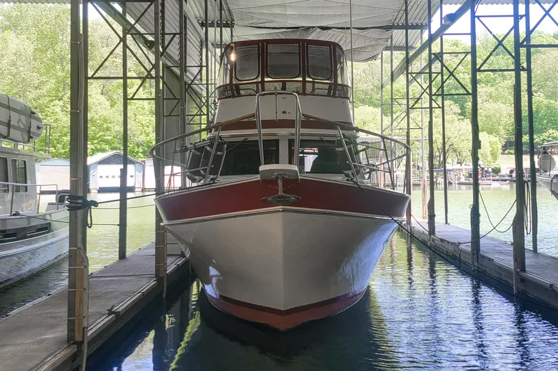 Slide: The Image of 1984 Wellcraft 44 Californian CMY docked in a covered marina. - 9