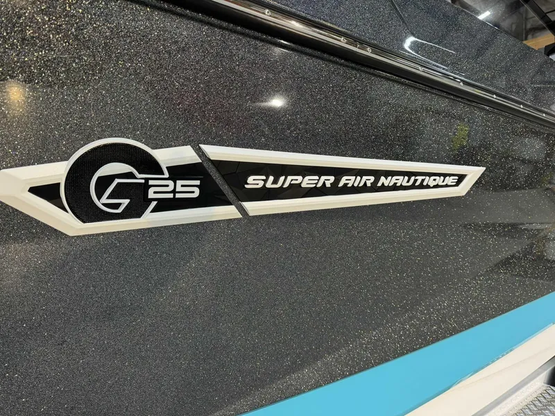 Slide: The Image of 2025 Nautique G25 Super Air boat with sleek, glittering exterior design. - 4