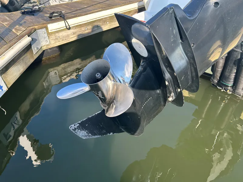 Slide: The Image of Outboard motor propeller of a 2018 Blackfin 242 CC boat at a dock. - 14