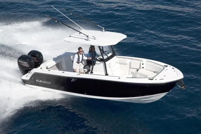 Slide: The Image of 2018 Blackfin 242 CC boat with Mercury outboard motor docked at marina. - 16