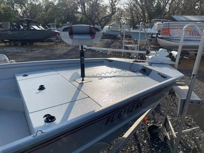 Slide: The Image of 2018 G3 Deluxe 18 boat on trailer, parked outdoors with other boats. - 5
