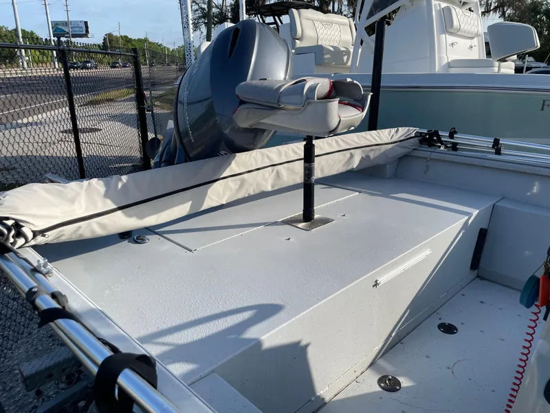 Slide: The Image of 2018 G3 Deluxe 18 boat with motor, docked near a fence. - 7