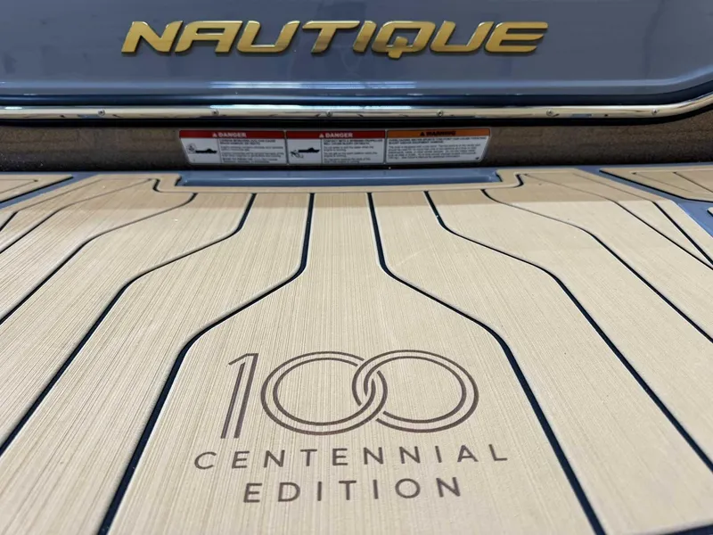 Slide: The Image of 2025 Nautique G23 Centennial Edition boat deck with logo and branding. - 4