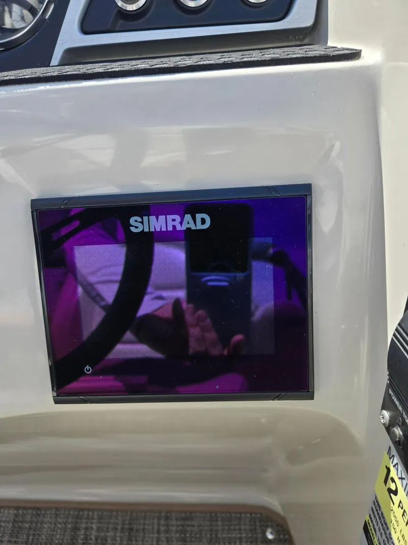 Slide: The Image of Simrad display on 2019 Manitou Oasis VP Tri Toon boat dashboard. - 12