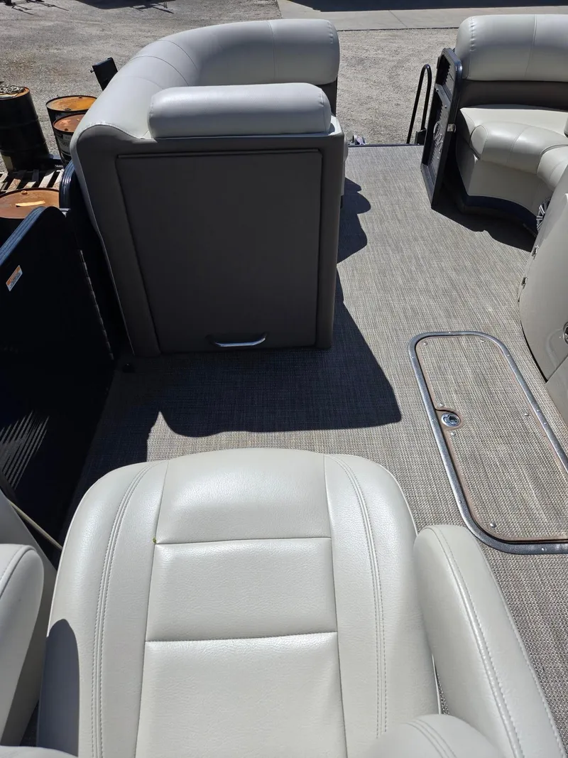 Slide: The Image of 2019 Manitou Oasis VP Tri Toon interior with gray seating and flooring. - 13