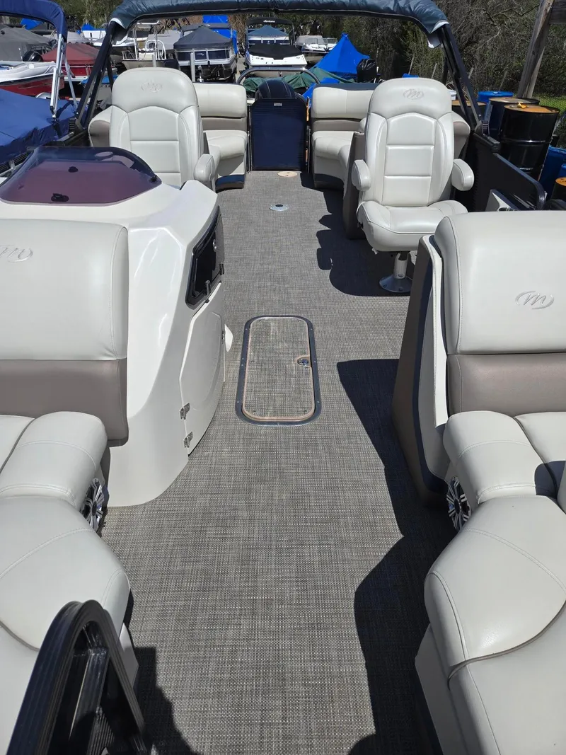 Slide: The Image of 2019 Manitou Oasis VP Tri Toon interior with plush seating and modern design. - 18