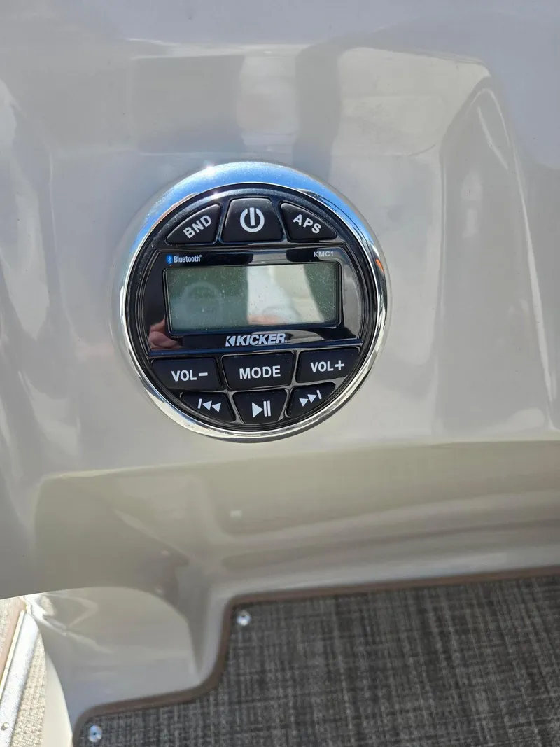 Slide: The Image of Kicker audio control panel on 2019 Manitou Oasis VP Tri Toon boat. - 9