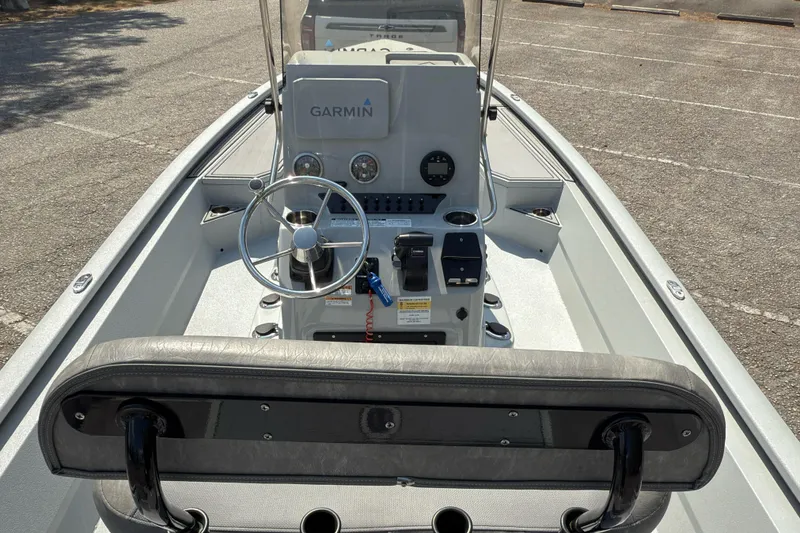 Slide: The Image of 2023 Avid 23 FS boat interior with Garmin navigation system and steering wheel. - 7