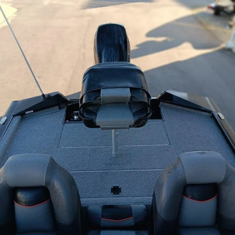 Slide: The Image of 2022 Tracker Pro Team 175 TXW boat interior with seating and deck view. - 11