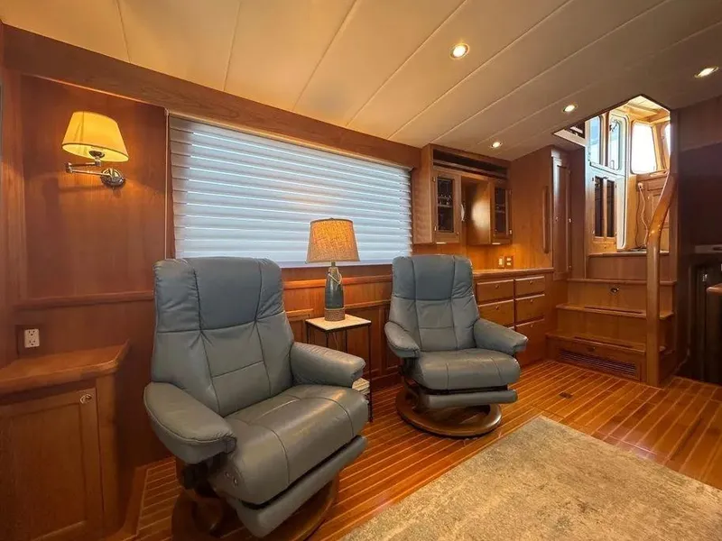 Slide: The Image of Luxurious interior of 2019 Kadey-Krogen 44AE yacht with plush seating and elegant wood finishes. - 15
