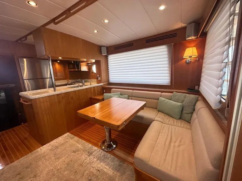 Slide: The Image of Luxurious 2019 Kadey-Krogen 44AE yacht interior with cozy seating and modern kitchen. - 2