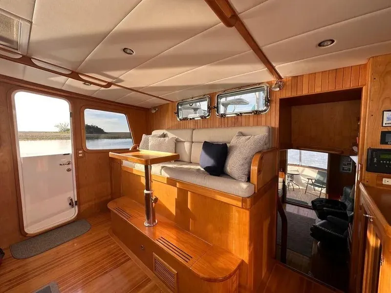 Slide: The Image of Luxurious interior of 2019 Kadey-Krogen 44AE yacht with plush seating and wooden accents. - 25