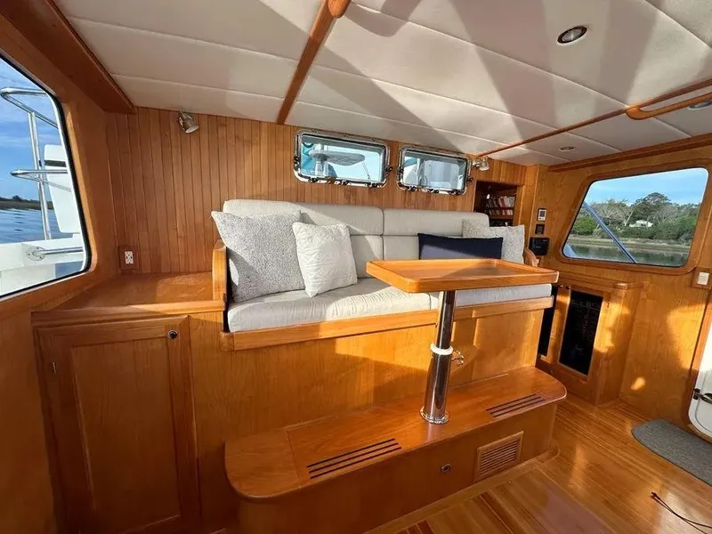 Slide: The Image of Luxurious 2019 Kadey-Krogen 44AE yacht interior with wooden finish and comfortable seating. - 26