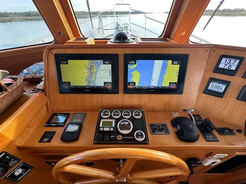 Slide: The Image of Pilothouse of 2019 Kadey-Krogen 44AE yacht with navigation screens and controls. - 27