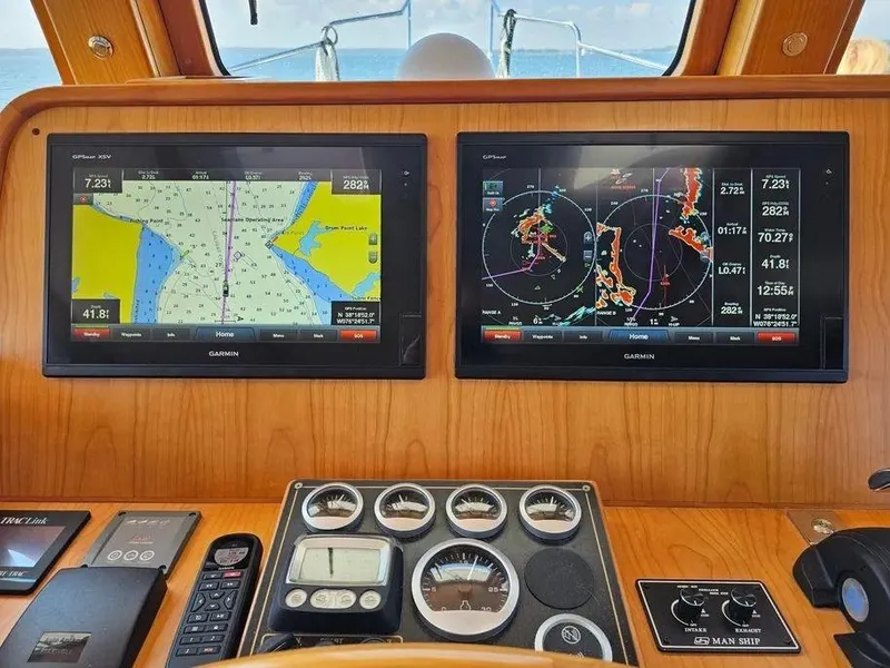 Slide: The Image of Kadey-Krogen 44AE 2019 yacht dashboard with navigation screens and control instruments. - 28