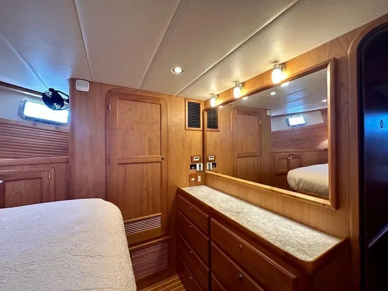 Slide: The Image of Luxurious wood-finished cabin interior of 2019 Kadey-Krogen 44AE yacht with ample storage. - 35