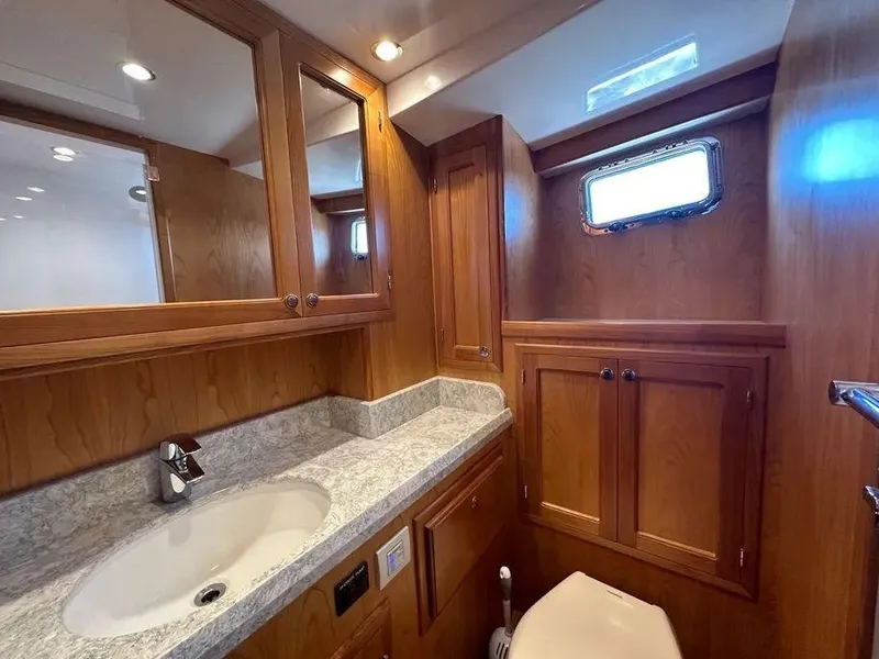 Slide: The Image of Luxurious Kadey-Krogen 44AE 2019 yacht bathroom with wood cabinetry and modern fixtures. - 37
