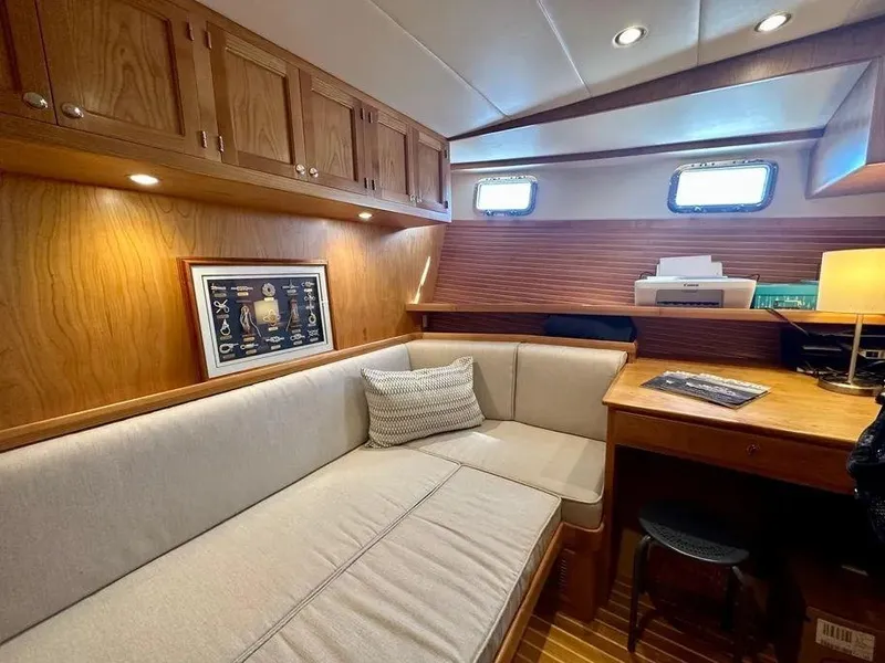 Slide: The Image of Cozy interior of 2019 Kadey-Krogen 44AE yacht with wood cabinetry and seating area. - 38