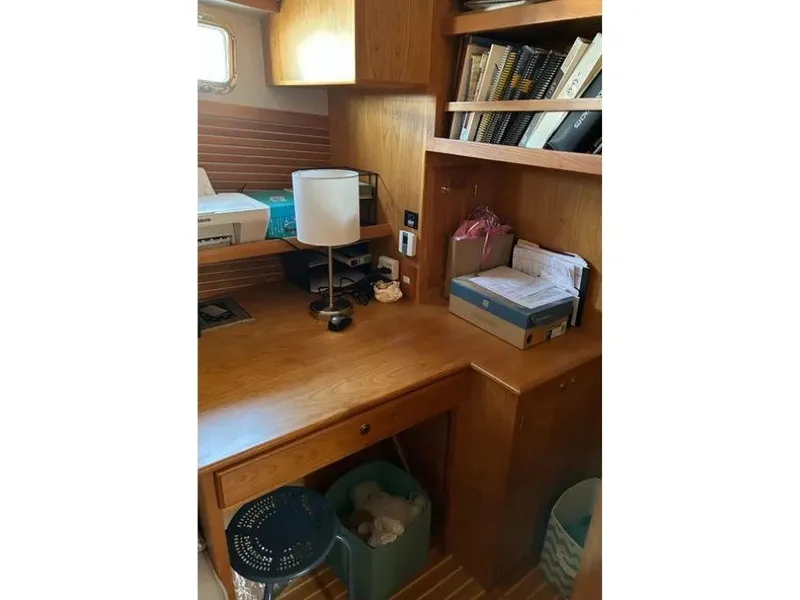 Slide: The Image of Cozy wooden desk area with bookshelves in a 2019 Kadey-Krogen 44AE yacht. - 39