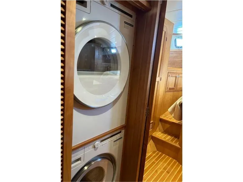 Slide: The Image of Stacked washer and dryer in 2019 Kadey-Krogen 44AE yacht interior. - 40