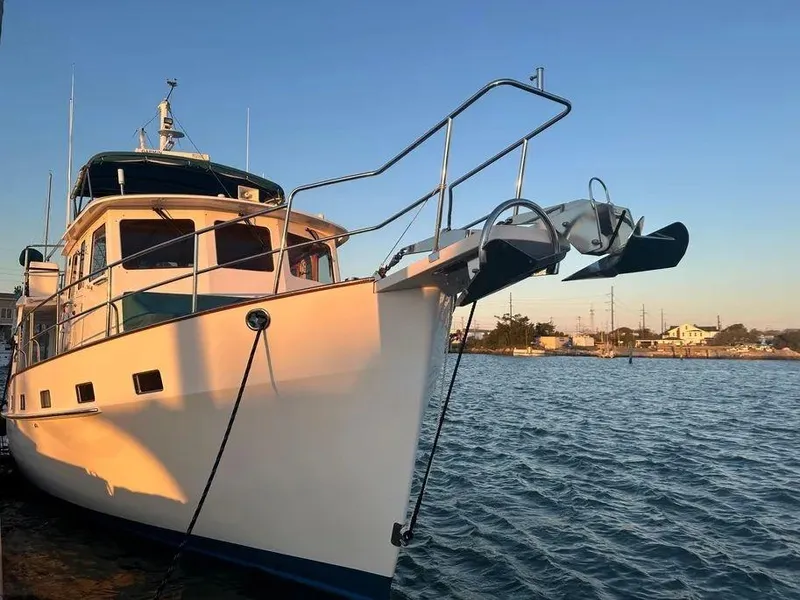 Slide: The Image of Kadey-Krogen 44AE 2019 yacht docked at sunset, reflecting on calm water. - 41