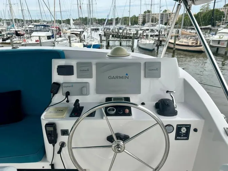 Slide: The Image of Helm of 2019 Kadey-Krogen 44AE yacht with Garmin navigation, docked at marina. - 46
