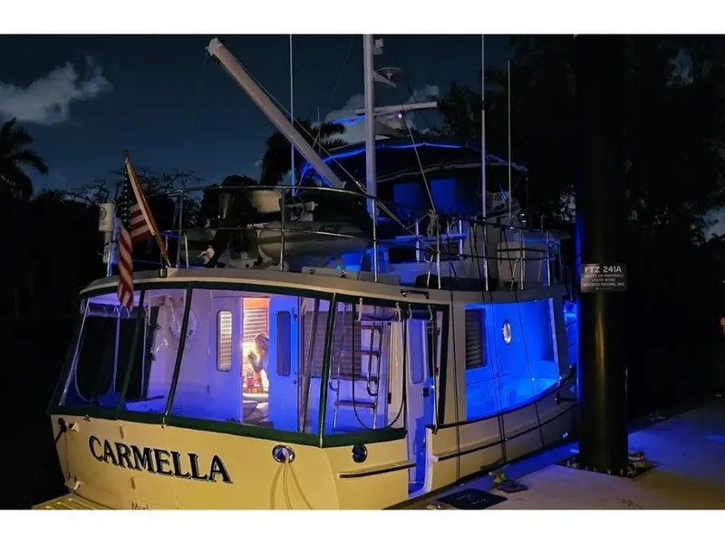 Slide: The Image of Kadey-Krogen 44AE 2019 yacht "Carmella" docked at night with blue lighting. - 57