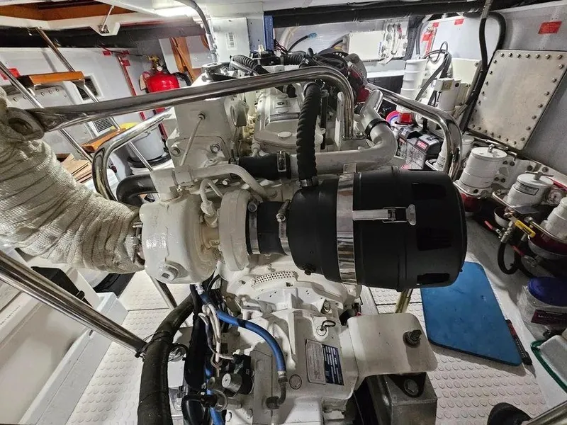 Slide: The Image of Engine room of 2019 Kadey-Krogen 44AE yacht, showcasing detailed machinery and components. - 60