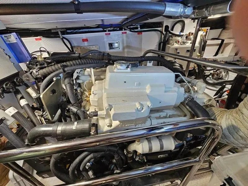 Slide: The Image of Engine room of 2019 Kadey-Krogen 44AE yacht, showcasing complex machinery and wiring. - 61