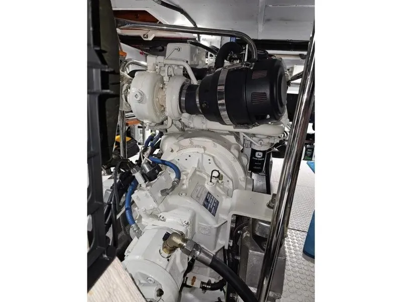 Slide: The Image of Engine room of 2019 Kadey-Krogen 44AE yacht, showcasing mechanical components and piping. - 62