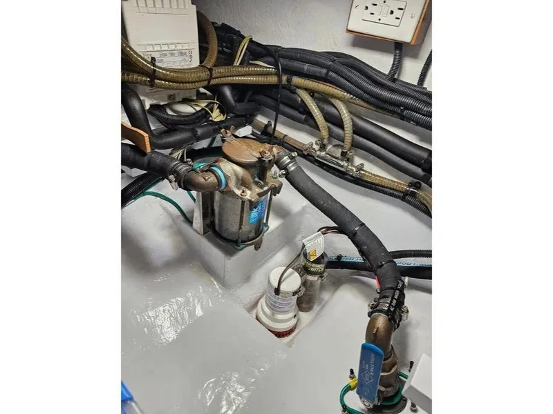 Slide: The Image of Engine room of 2019 Kadey-Krogen 44AE yacht with visible pipes and machinery. - 64