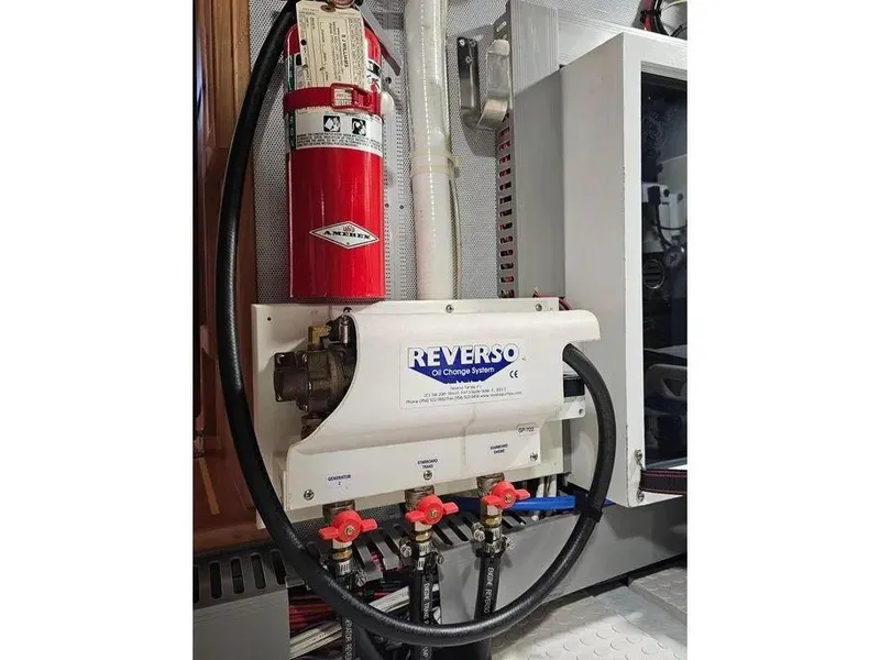Slide: The Image of Engine room of 2019 Kadey-Krogen 44AE with Reverso oil change system and fire extinguisher. - 66