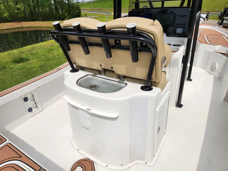 Slide: The Image of 2017 Sea Hunt BX 25 BR boat interior with seating and rod holders. - 12