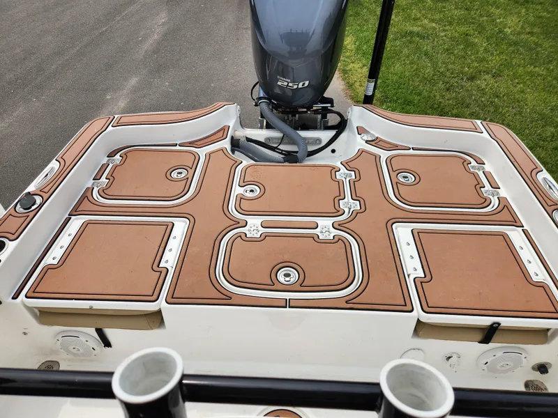 Slide: The Image of 2017 Sea Hunt BX 25 BR boat deck with Yamaha 250 engine, featuring tan non-slip surface. - 15