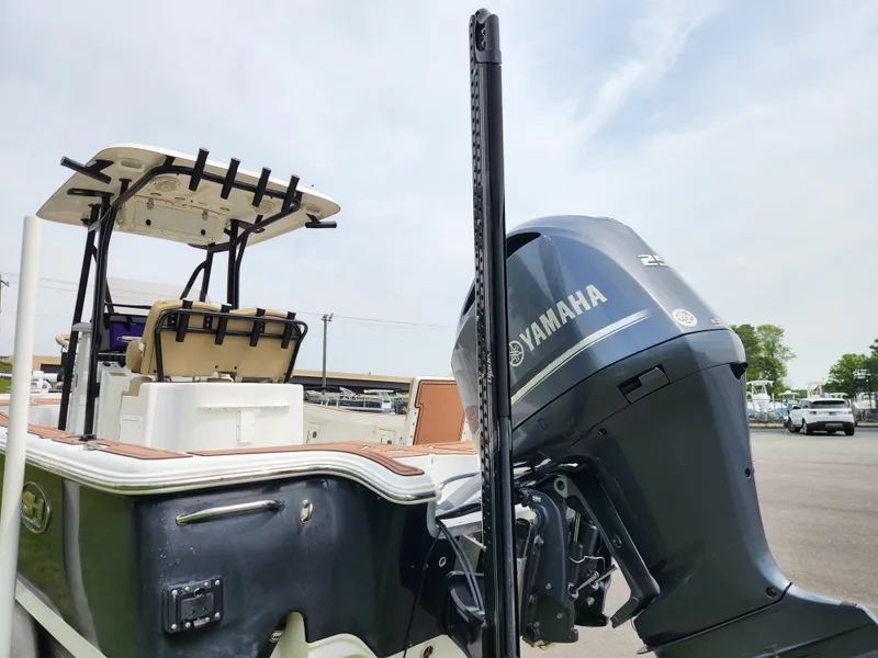 Slide: The Image of 2017 Sea Hunt BX 25 BR boat with Yamaha outboard motor, docked outdoors. - 3