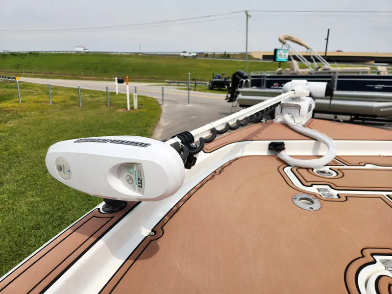 Slide: The Image of 2017 Sea Hunt BX 25 BR boat with trolling motor on deck, parked near road. - 7