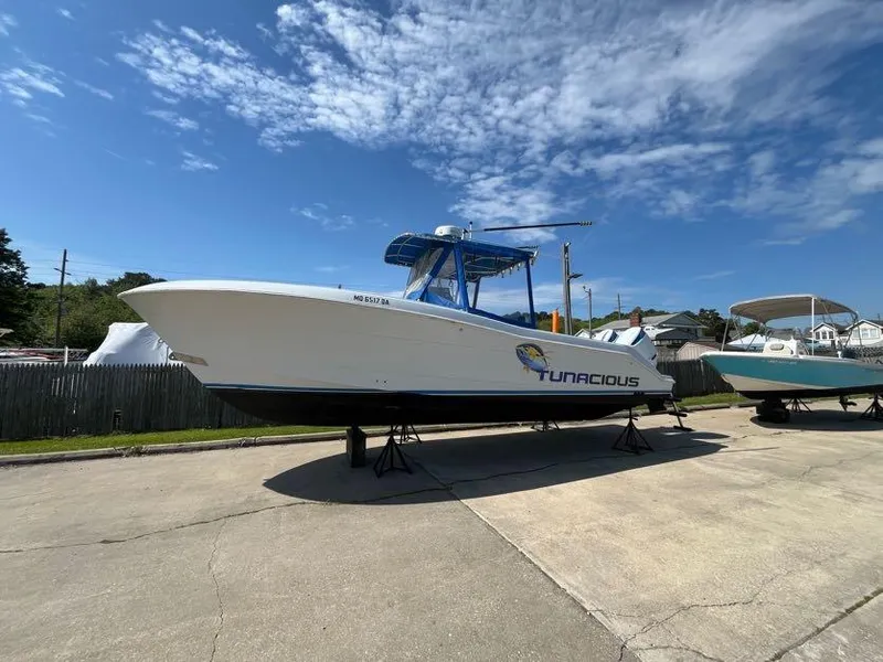 Slide: The Image of 2000 Hydra-Sports 2796 Vector boat on stands under a clear blue sky. - 3