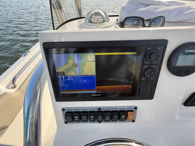 Slide: The Image of Garmin navigation system on 2021 Key West 203 DFS boat dashboard, displaying water depth and map. - 15