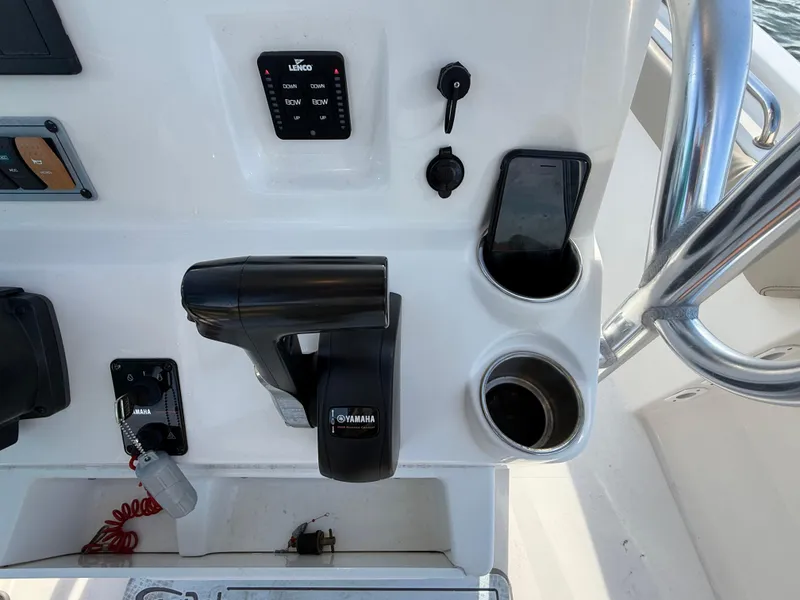 Slide: The Image of Control panel of 2021 Key West 203 DFS boat with Yamaha throttle and phone holder. - 17