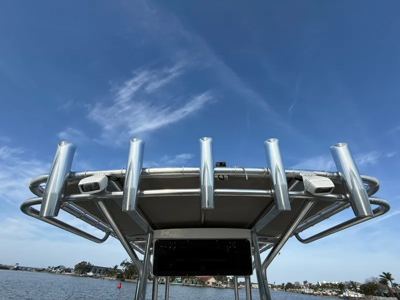 Slide: The Image of T-top of 2021 Key West 203 DFS boat against blue sky and water backdrop. - 25