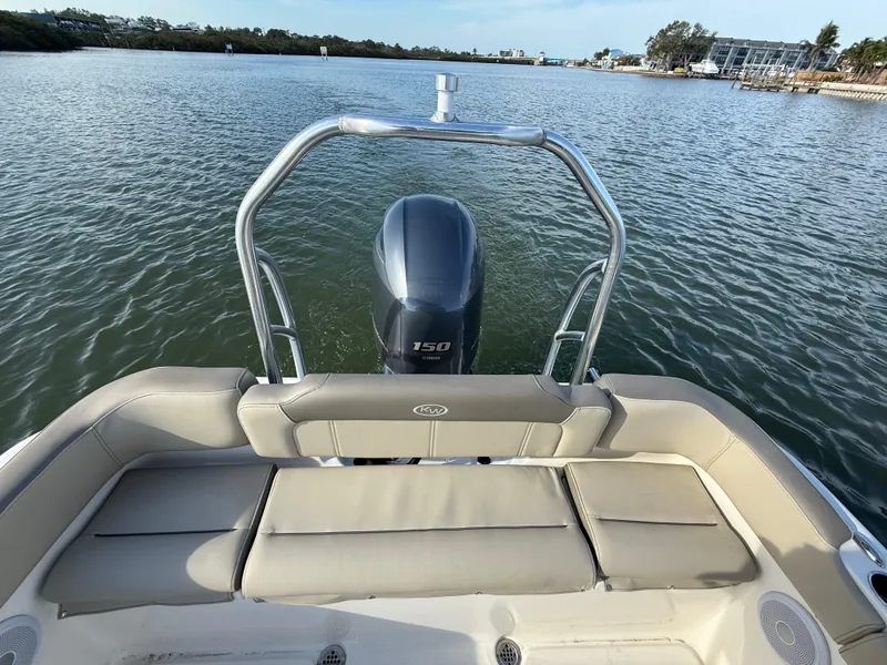 Slide: The Image of 2021 Key West 203 DFS boat with outboard motor on calm water. - 31