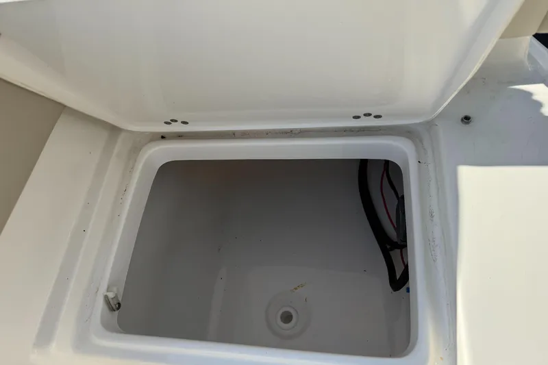 Slide: The Image of Open storage compartment on a 2021 Key West 203 DFS boat. - 43