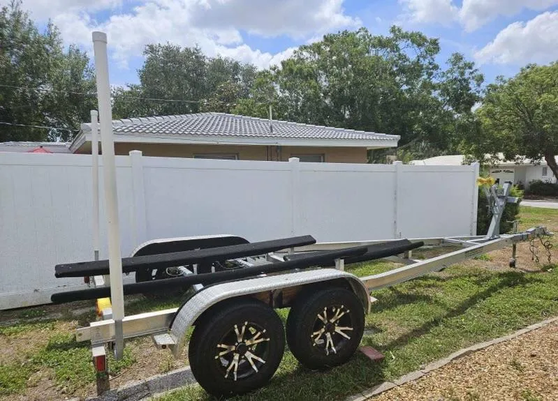 Slide: The Image of Trailer for 2021 Key West 203 DFS boat, parked outdoors on grass. - 45