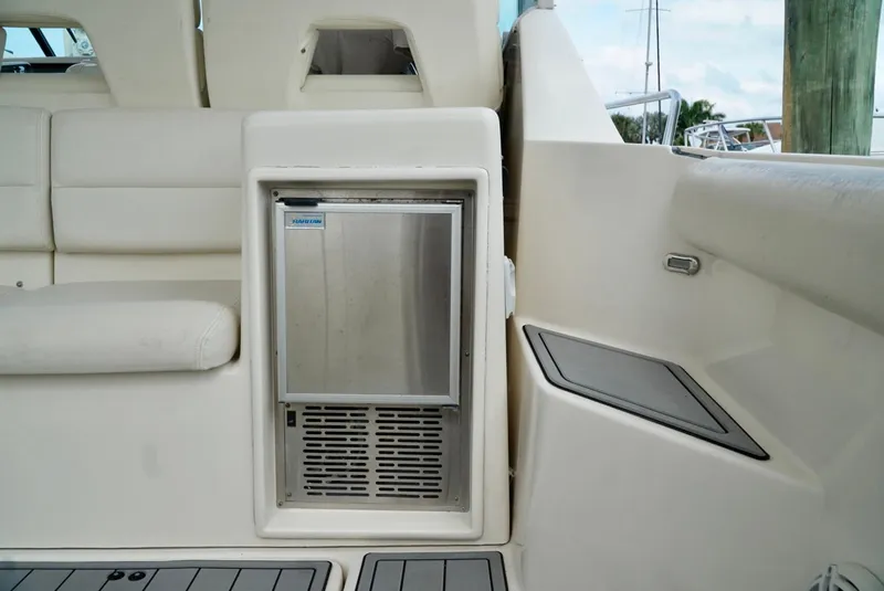 Slide: The Image of 1998 Tiara Yachts 4000 Express interior with built-in stainless steel refrigerator. - 15