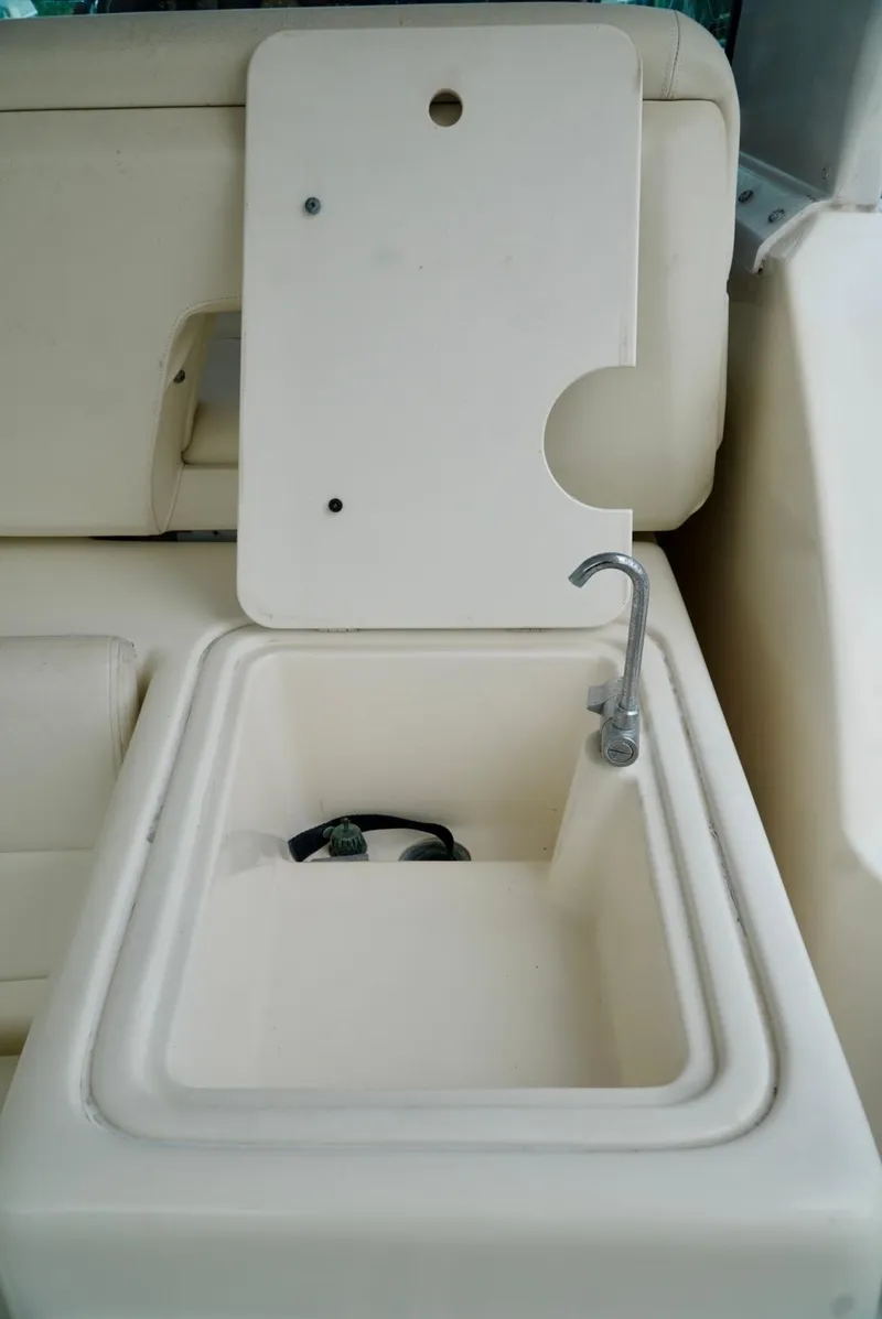Slide: The Image of 1998 Tiara Yachts 4000 Express boat sink with faucet and cover. - 16