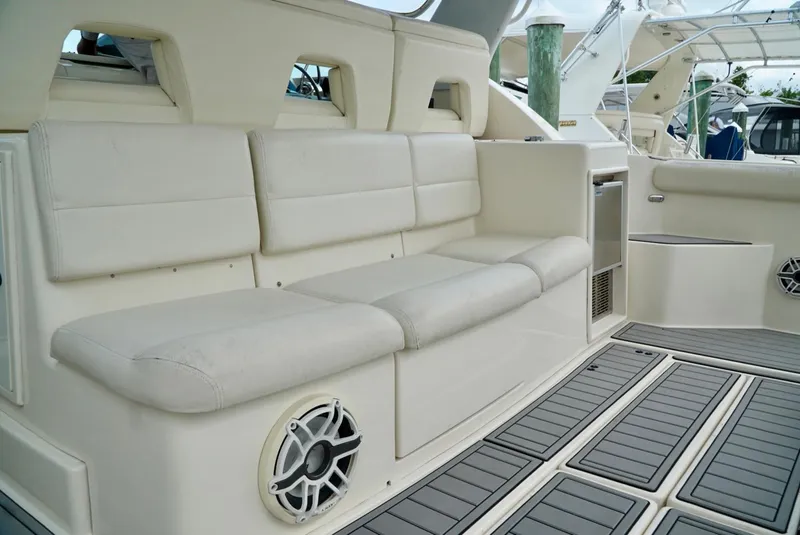 Slide: The Image of 1998 Tiara Yachts 4000 Express interior with beige seating and marine speaker. - 18