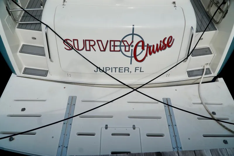 Slide: The Image of 1998 Tiara Yachts 4000 Express boat with "Survey Cruise" name, docked in Jupiter, FL. - 9