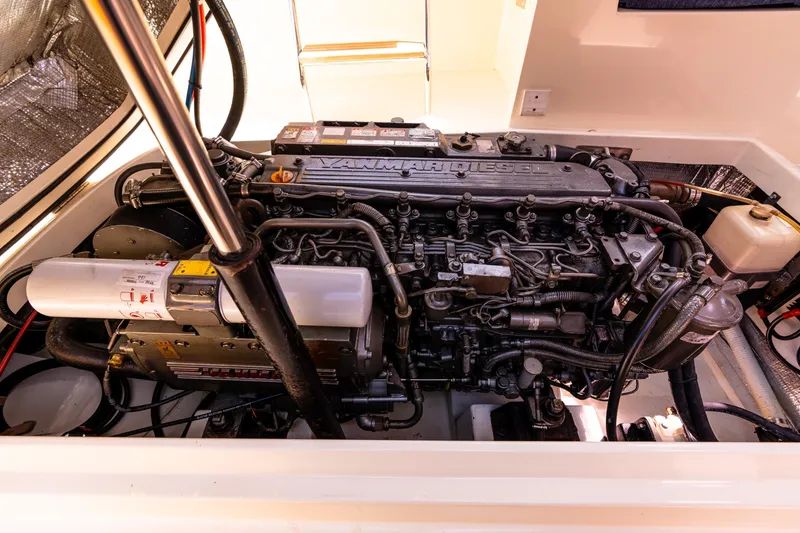 Slide: The Image of Engine compartment of a 2002 Hinckley Picnic Boat EP, showcasing detailed mechanical components. - 38