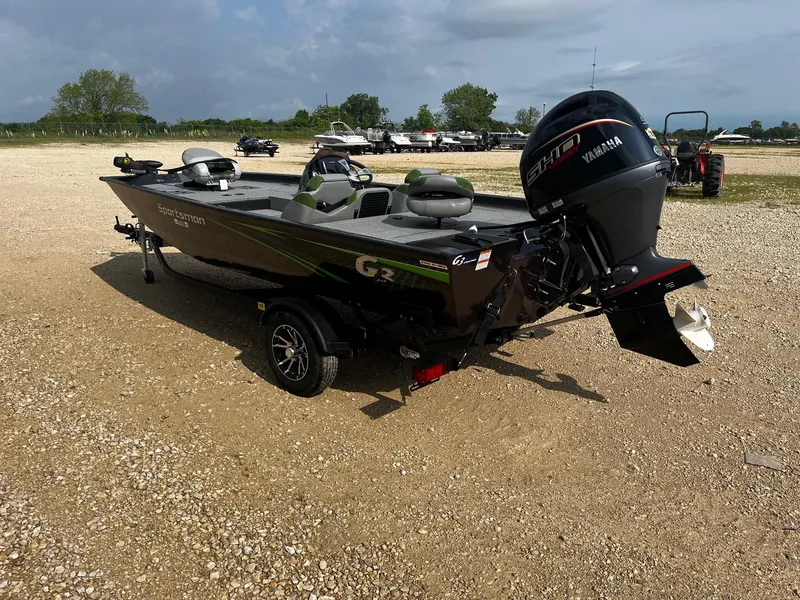 Slide: The Image of 2025 G3 Sportsman 1710 PFX boat with Yamaha engine on gravel lot. - 6