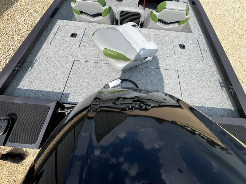 Slide: The Image of 2025 G3 Sportsman 1710 PFX boat interior with seating and storage compartments. - 8